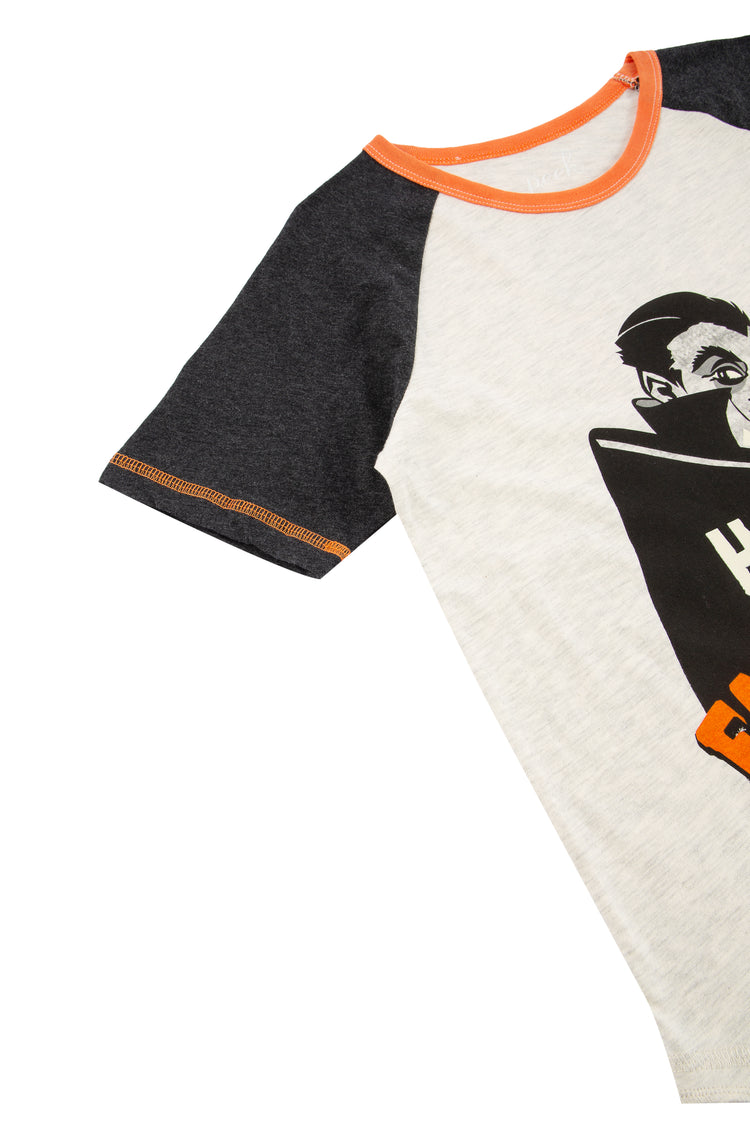 CLOSE UP OF WHITE AND BLACK RAGLAN TEE AND ORANGE AND BLACK VAMPIRE THEMED HALLOWEEN GRAPHIC "HAVE A FANG-TASTIC DAY"
