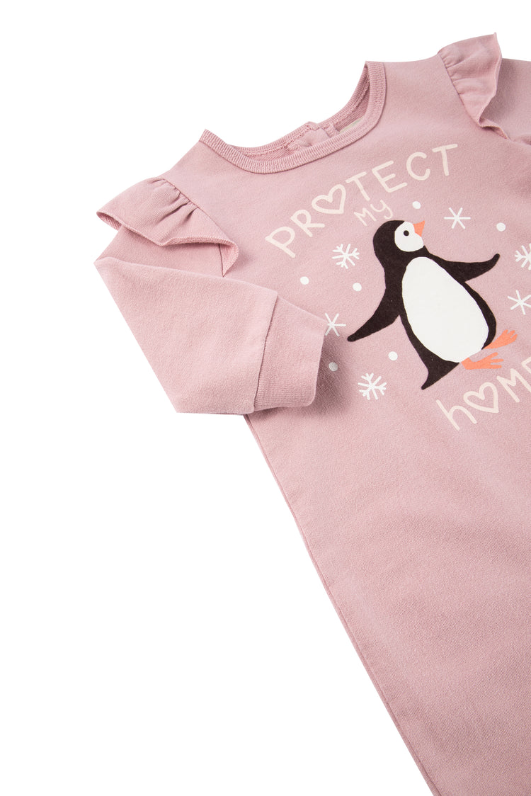 Close up view of child's pink penguin romper with "protect my home" written