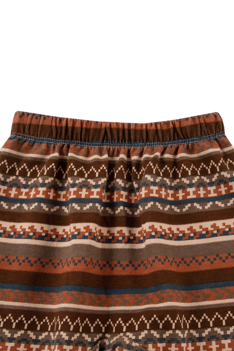 Close up of multi-pattern, brown striped sweatpants with elastic waist.