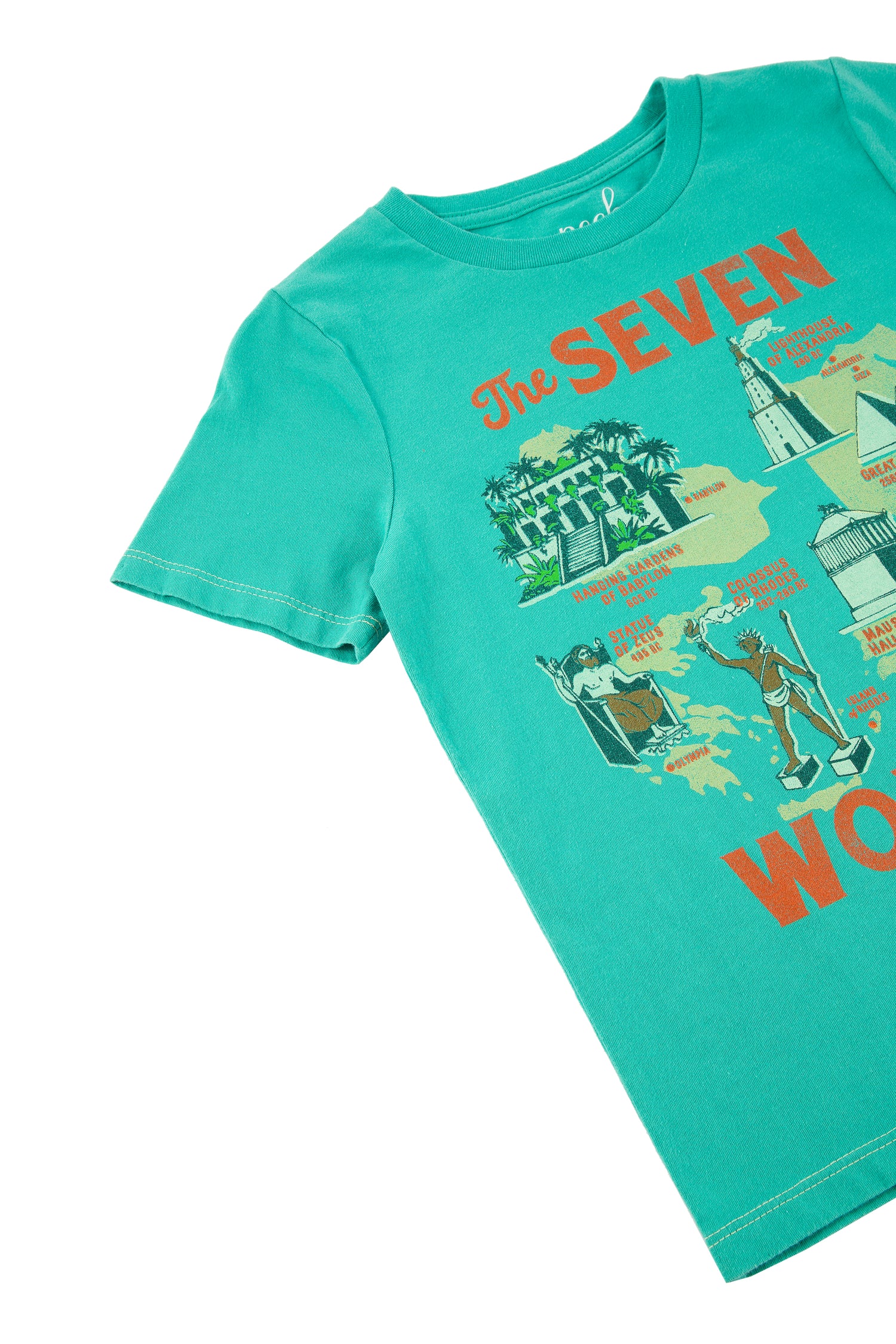 Close up of turquoise t-shirt with orange 'the seven wonders' text