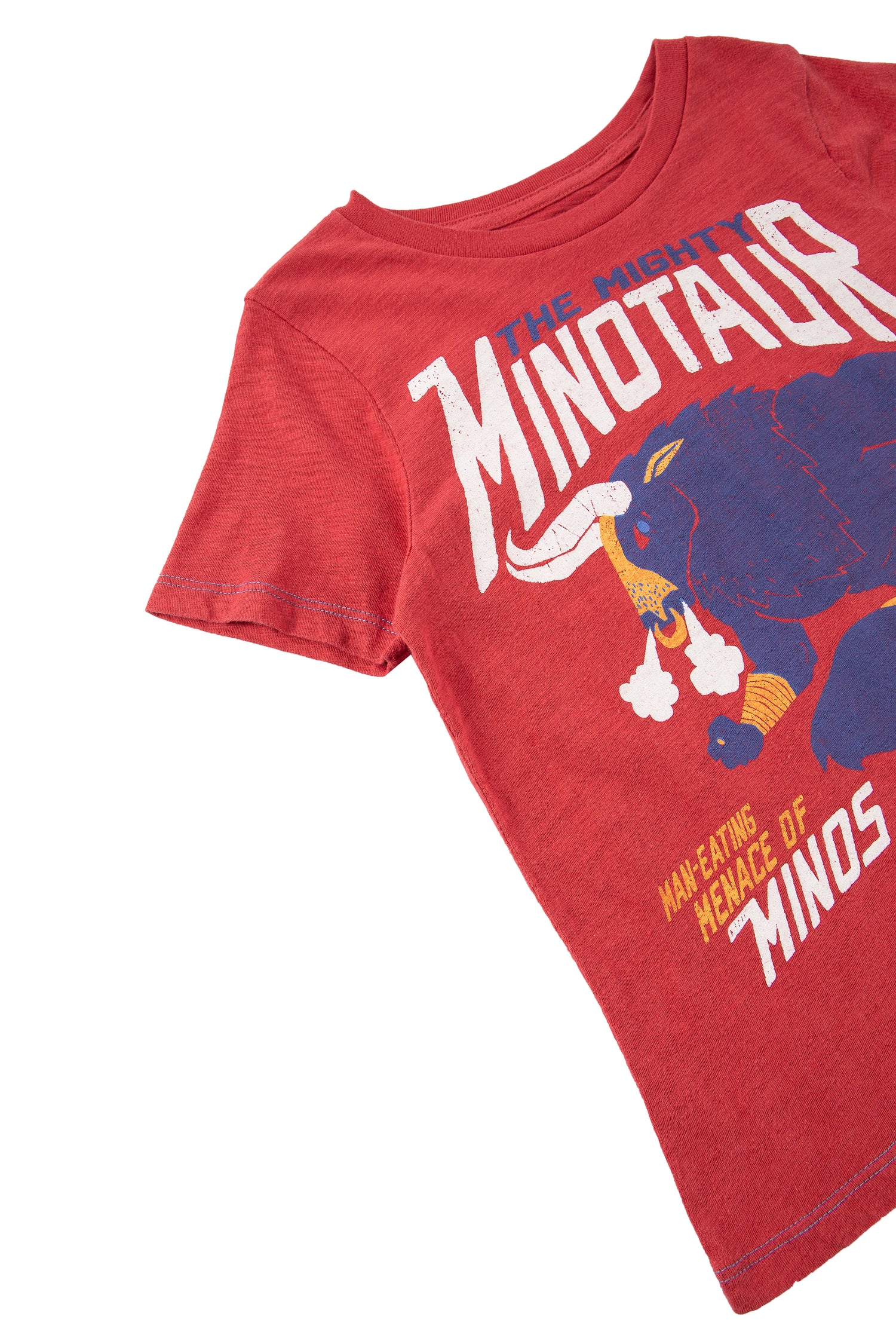 Close up of red t-shirt with minotaur illustration and text 'the mighty minotaur'