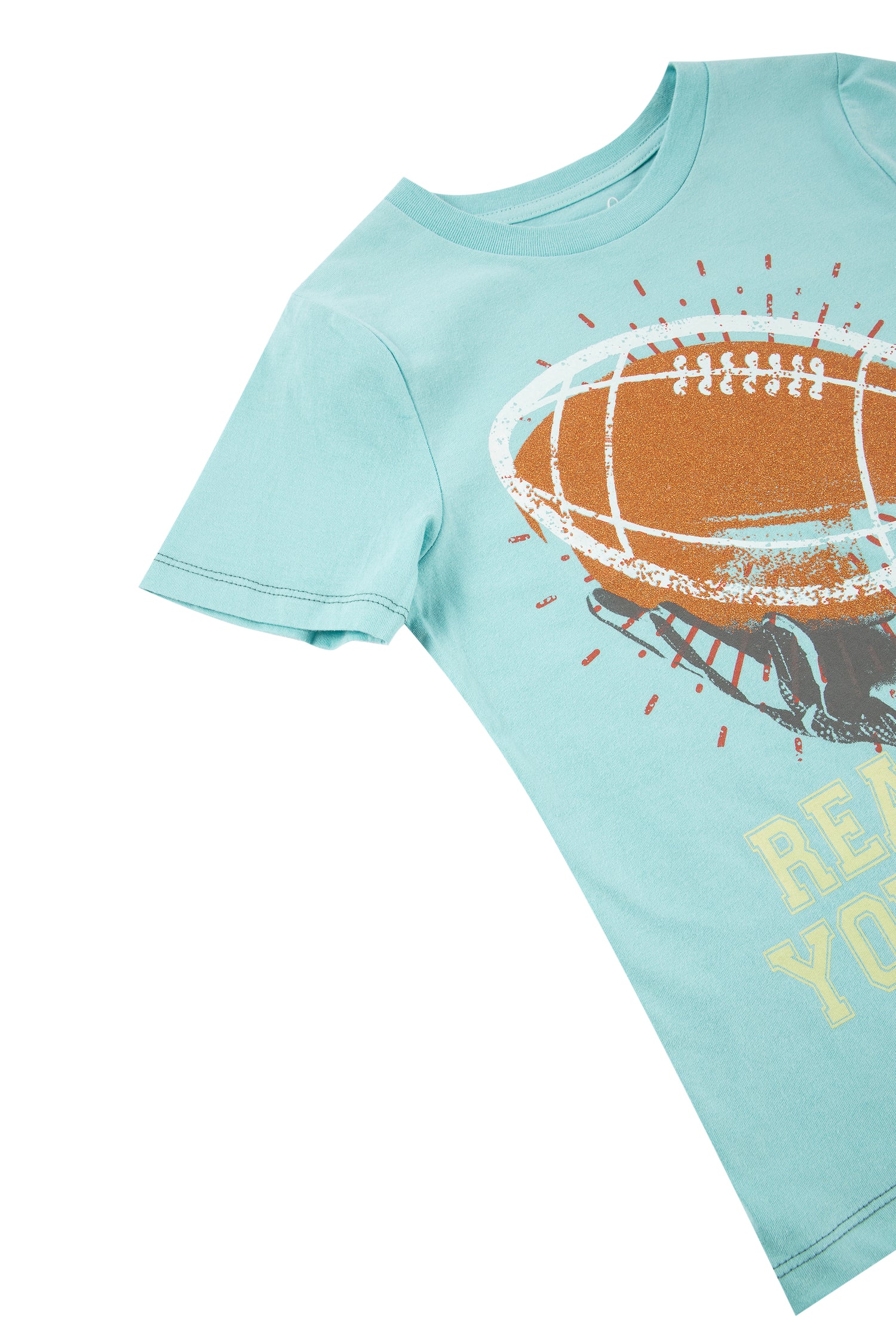 Close up view of blue tee with a football and "reach for your goals" written