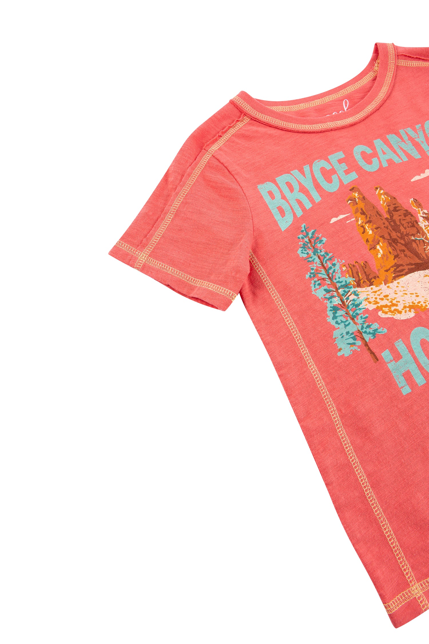 CLOSE UP OF RED T-SHIRT WITH MOUNTAIN GRAPHICS AND "BRYCE CANYON HOODOOS TALL ROCK FORMATIONS PROTRUDING FROM THE GROUND"