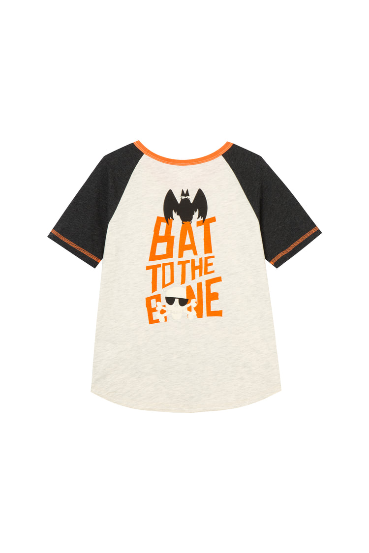 BACK OF WHITE AND BLACK RAGLAN TEE WITH ORANGE AND BLACK VAMPIRE THEMED HALLOWEEN GRAPHIC "BAT TO THE BONE"
