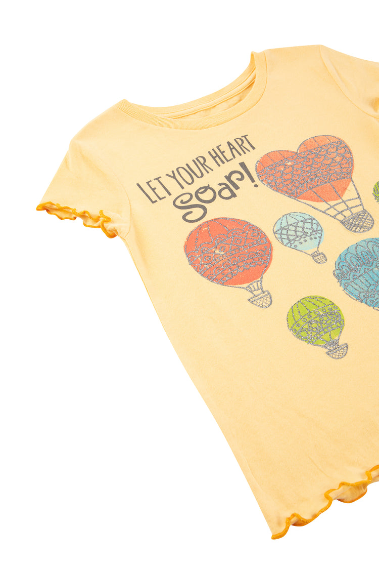 Side view of yellow shirt with hot air balloon image and "let your heart soar"