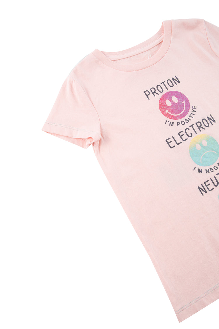 Close up of pink t-shirt with "Proton, electron, neutron" wording 