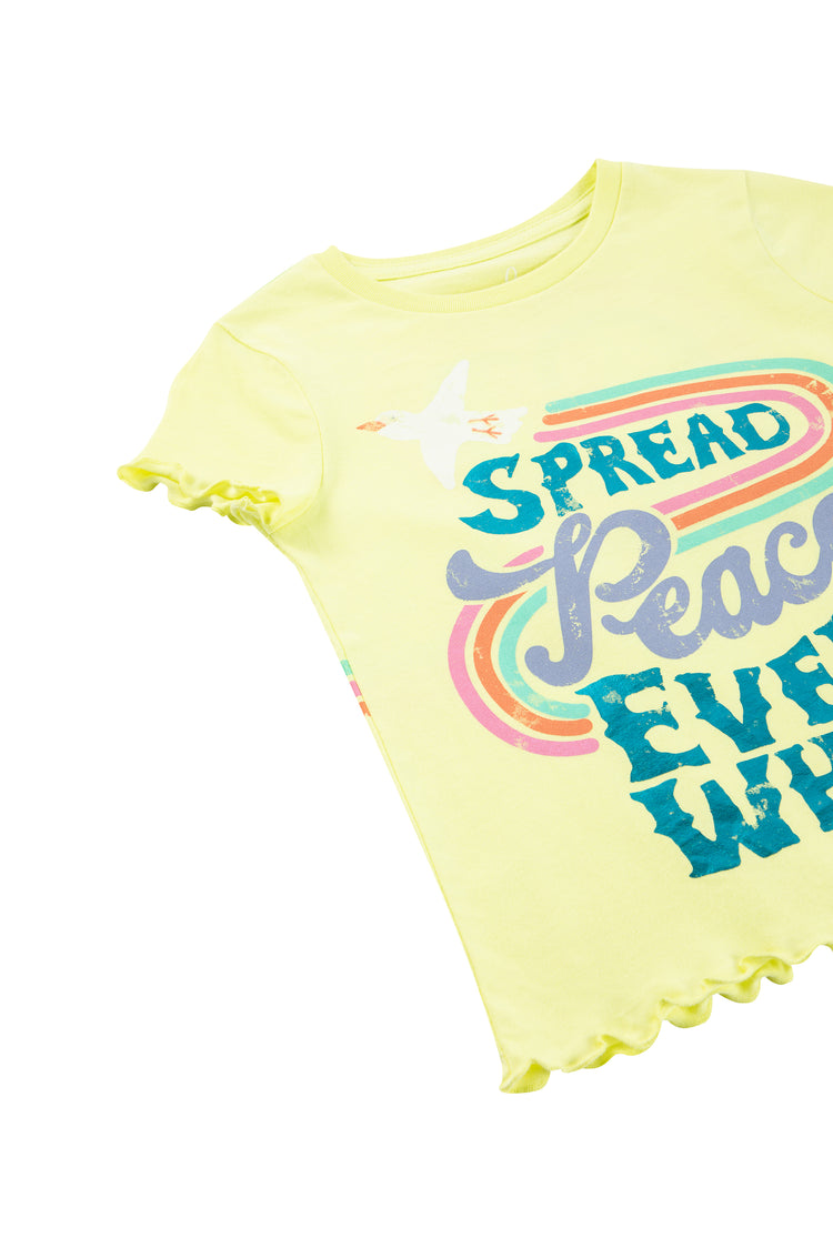 CLOSE UP OF YELLOW T-SHIRT WITH THE WORDS "SPREAD PEACE EVERY WHERE"