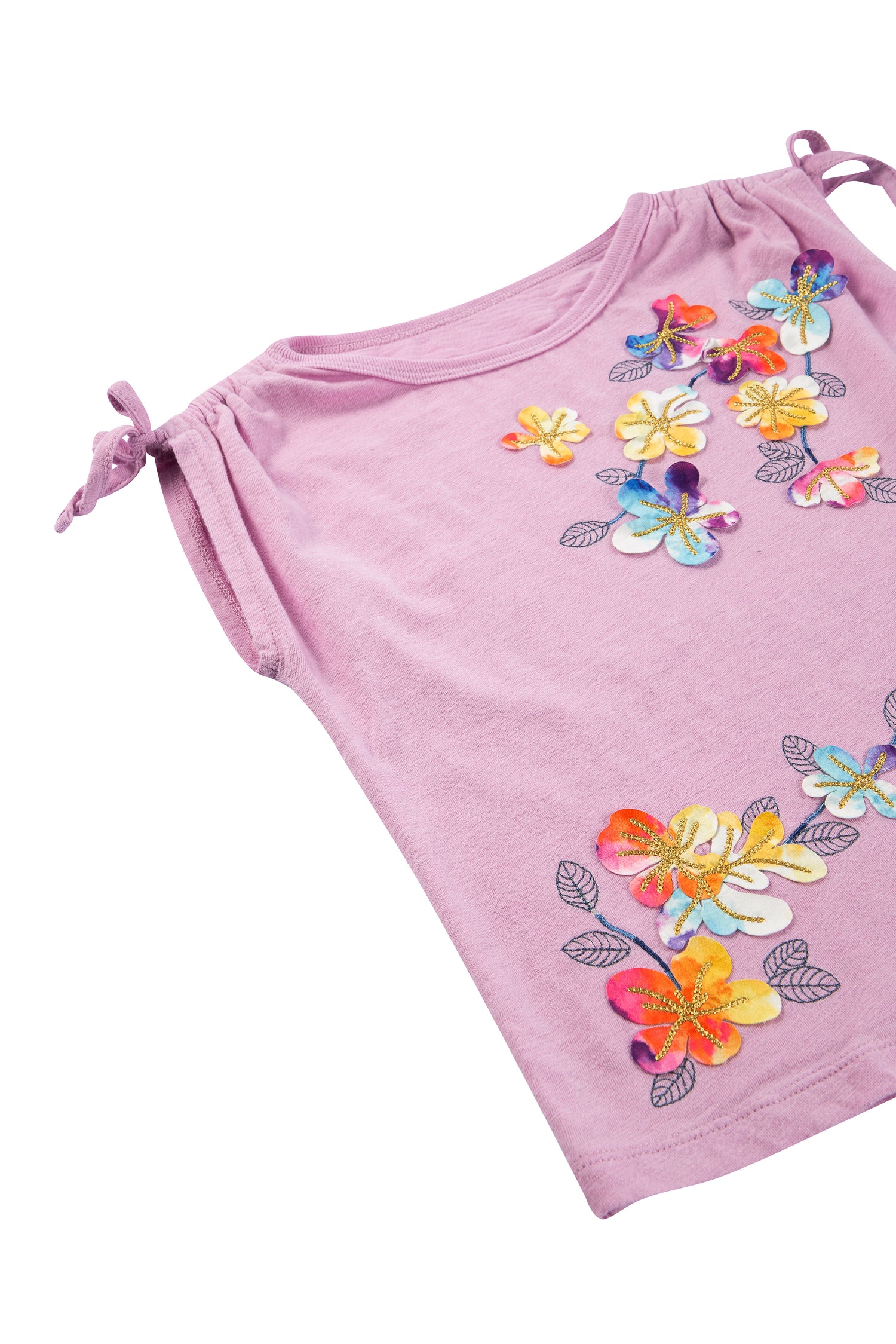 CLOSE UP OF PINK SHORT-SLEEVE TOP WITH APPLIQUED FLOWERS