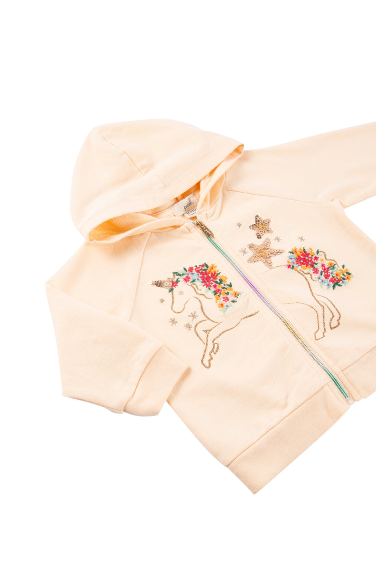 Close up of pink zip-up hoodie with sparkly embroidered unicorn illustration