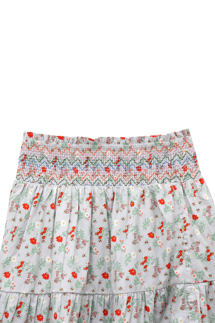 CLOSE UP OF GREY FLORAL PRINT PIXIE SKIRT WITH SMOCKED WAIST