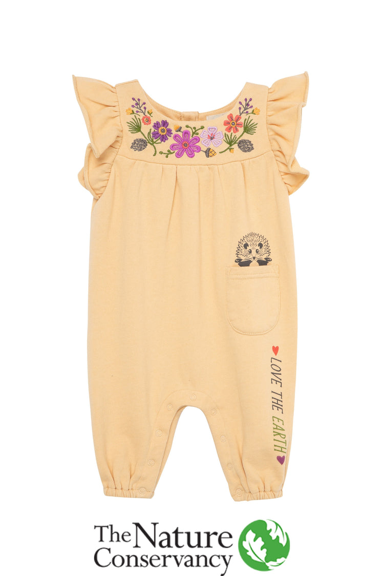 Yellow romper with knit flower pattern, illustrated porcupine & 'love the earth' text