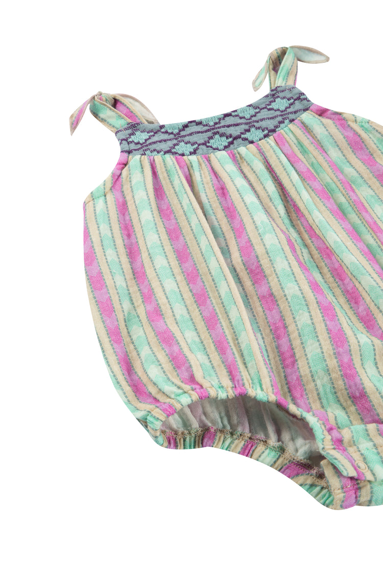 CLOSE UP OF GREEN AND PINK STRIPED GAUZE BUBBLE ROMPER