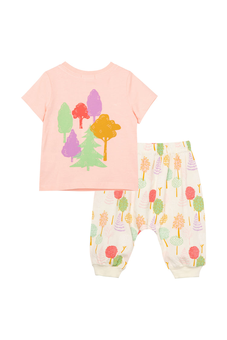 Back of pink t-shirt with illustrated trees and off-white sweatpants with tree pattern