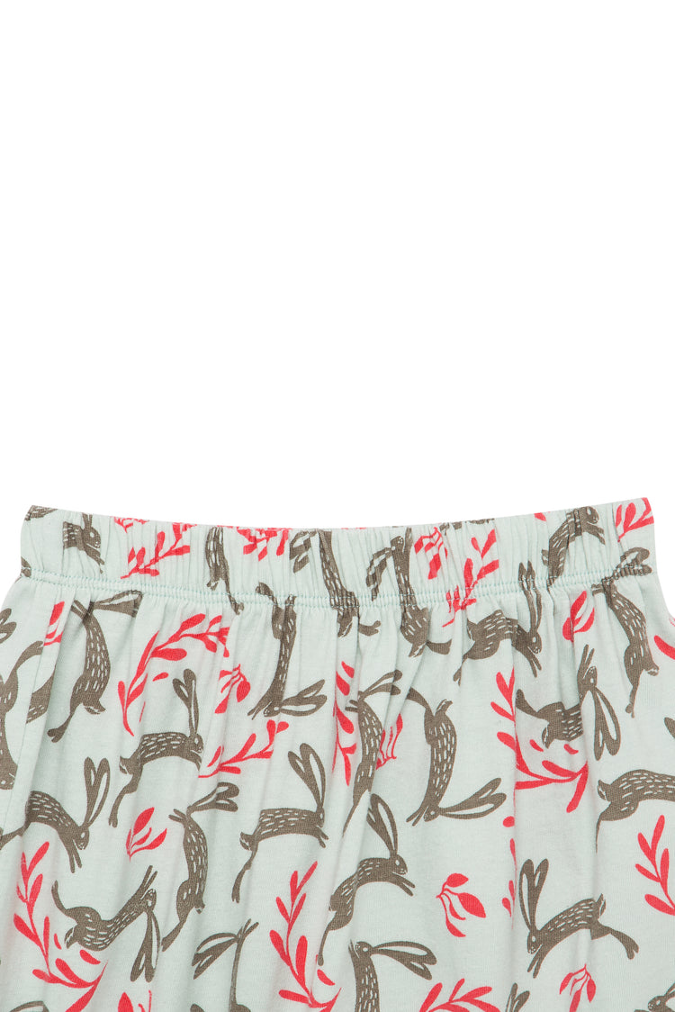 Close up of gray sweatpants with illustrated rabbit and red flower pattern