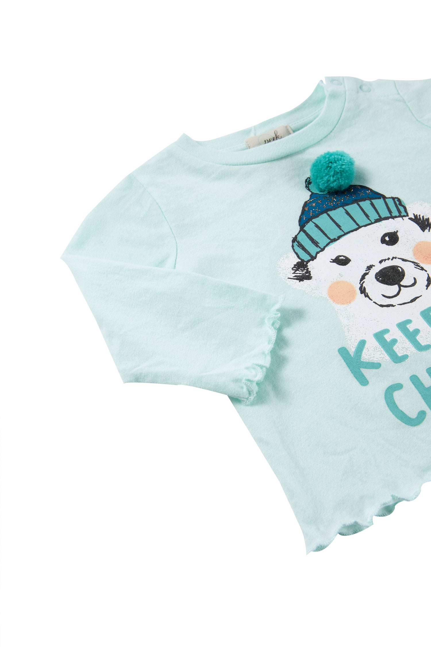 Close up view of white and blue polar bear themed shirt with "keep it chilly" written
