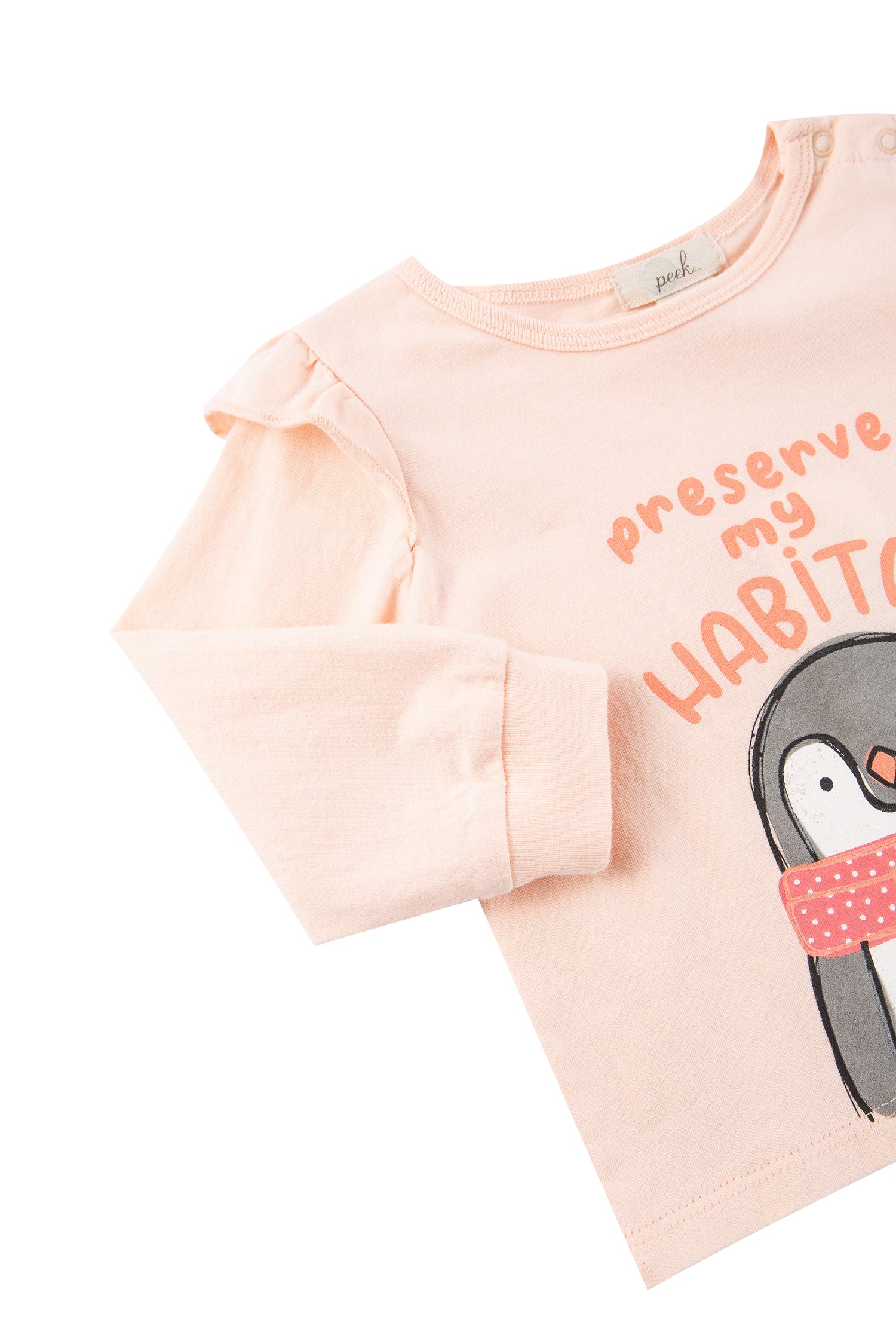 Close up view of pink and brown shirt with penguin image 