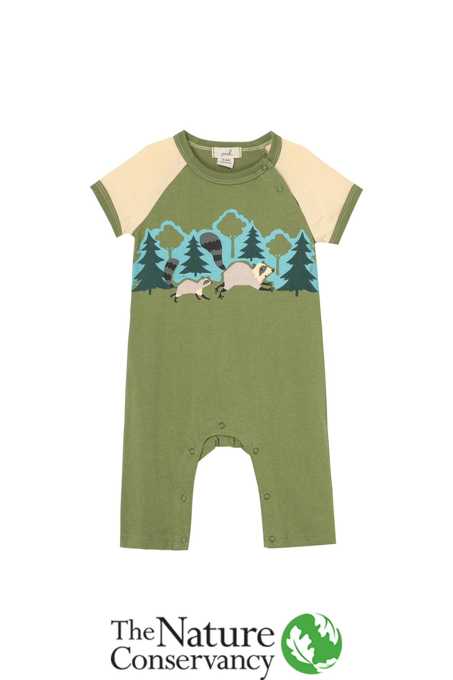Green and off-white onesie with illustrated raccoons running through a forest
