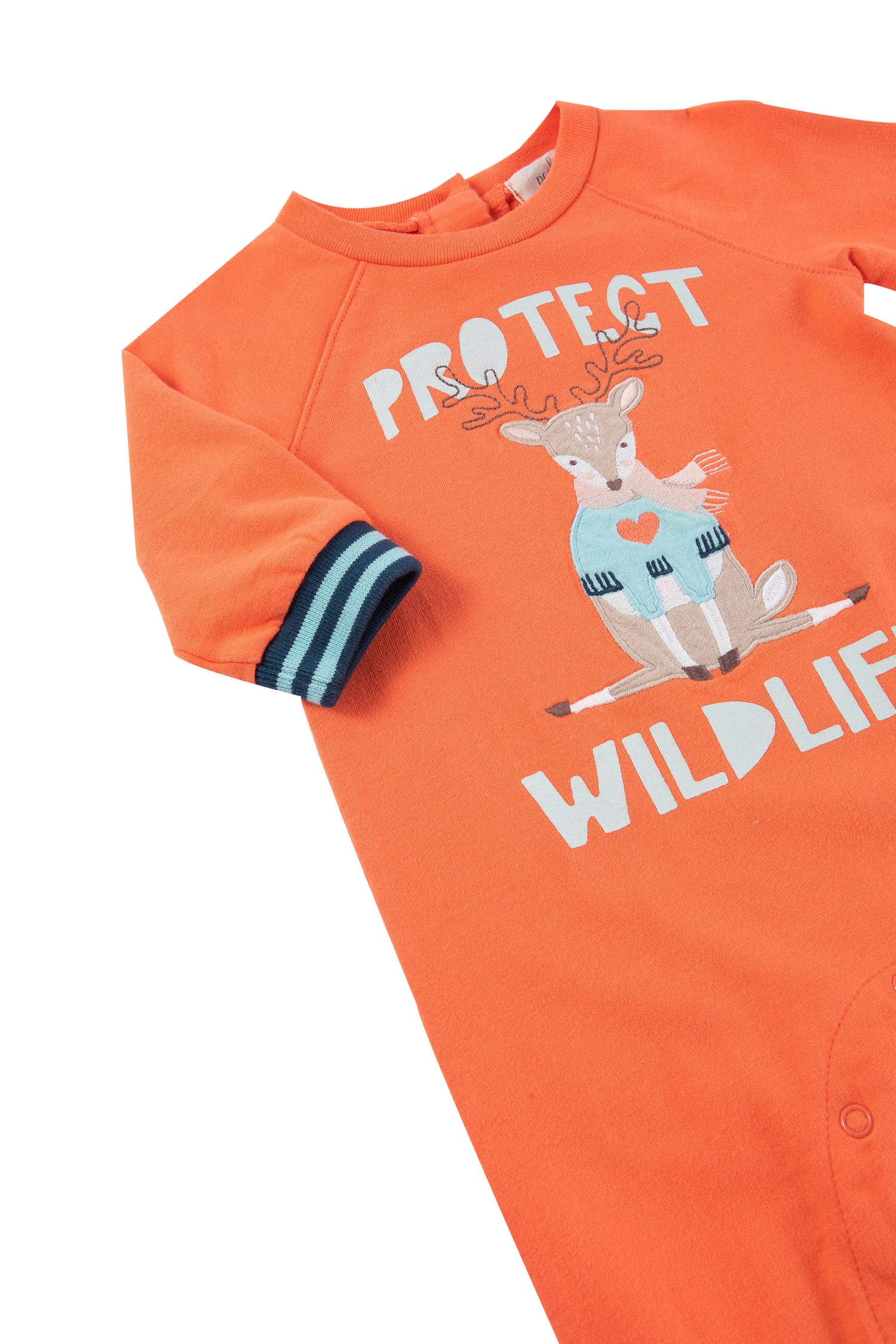 Close up view of orange baby jumpsuit with reindeer and "protect wildlife" written