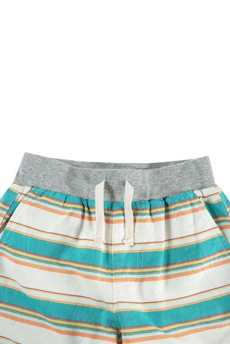 Close up of blue, yellow, red striped shorts with elastic waist and faux drawstring. 