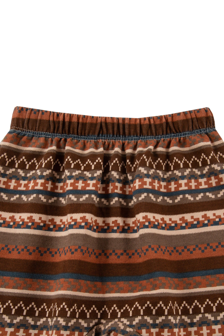 Close up of  multi-pattern, brown striped sweatpants with elastic waist. 