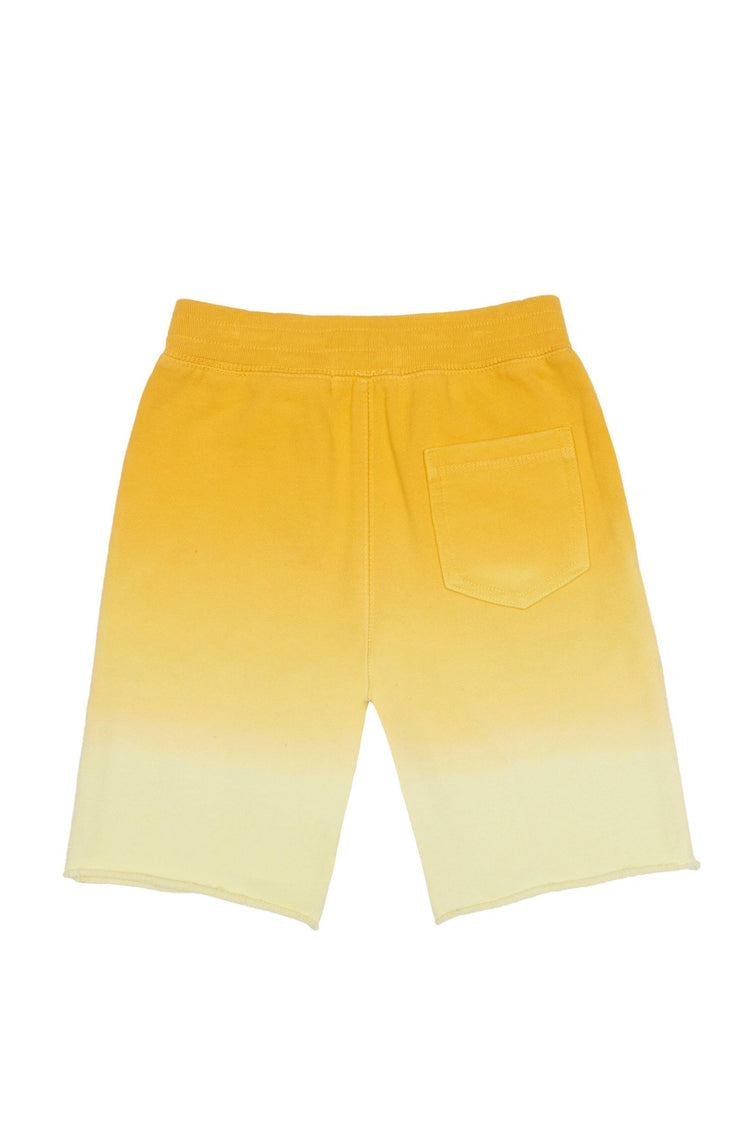 Back of ombre yellow knit shorts with elastic waist and one back pocket.